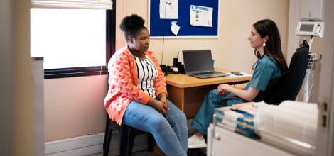 Doctor and patient talking in consultation room